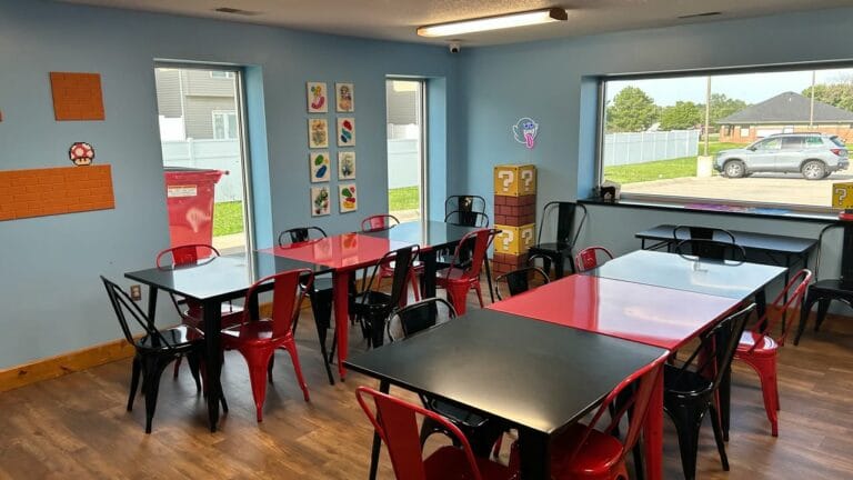 The "Mario Room" seats around 20-25.